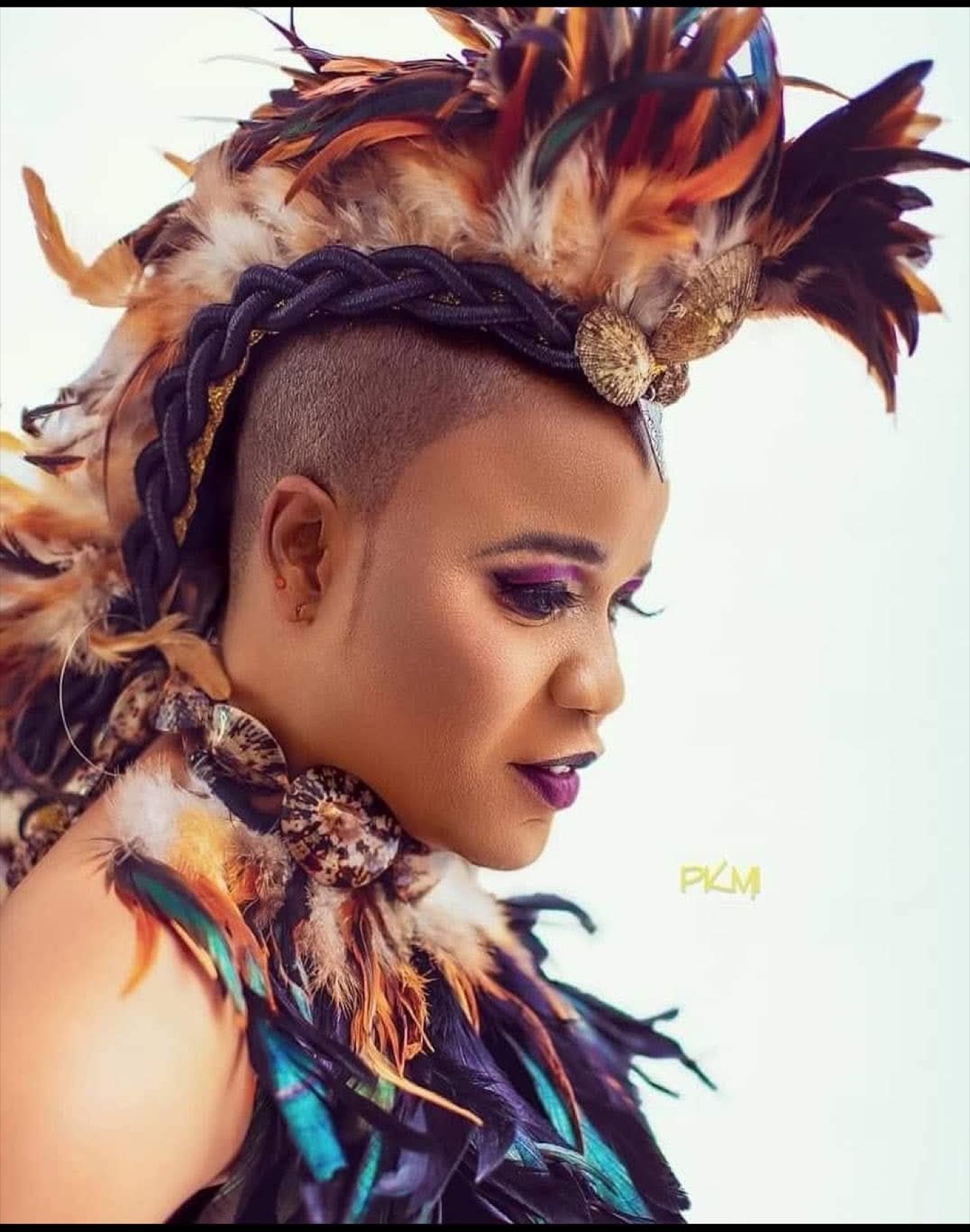 Sherifa Gunu in feather headdress