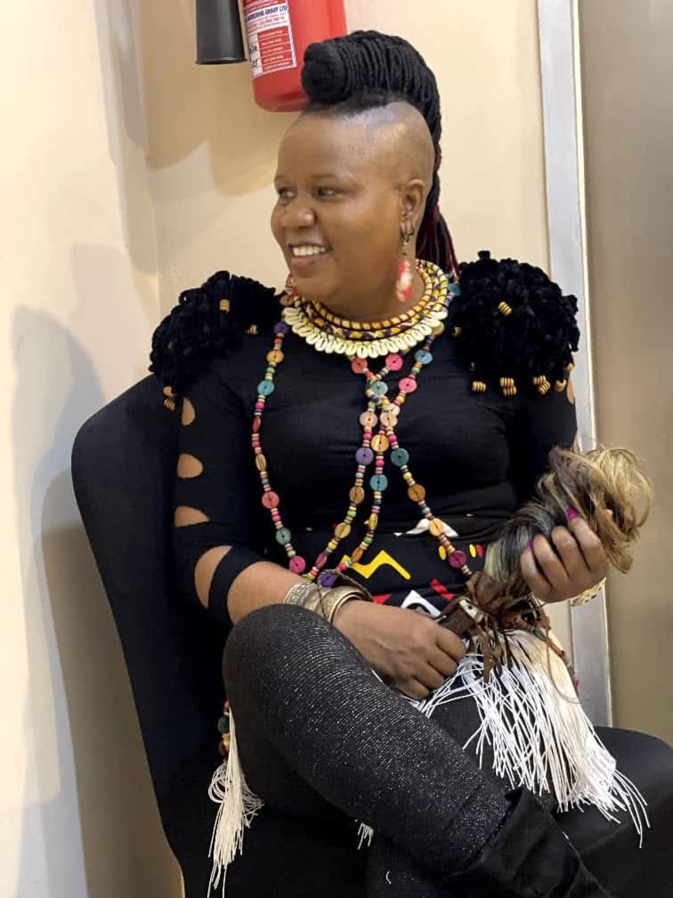 Sherifa Gunu seated, wearing black