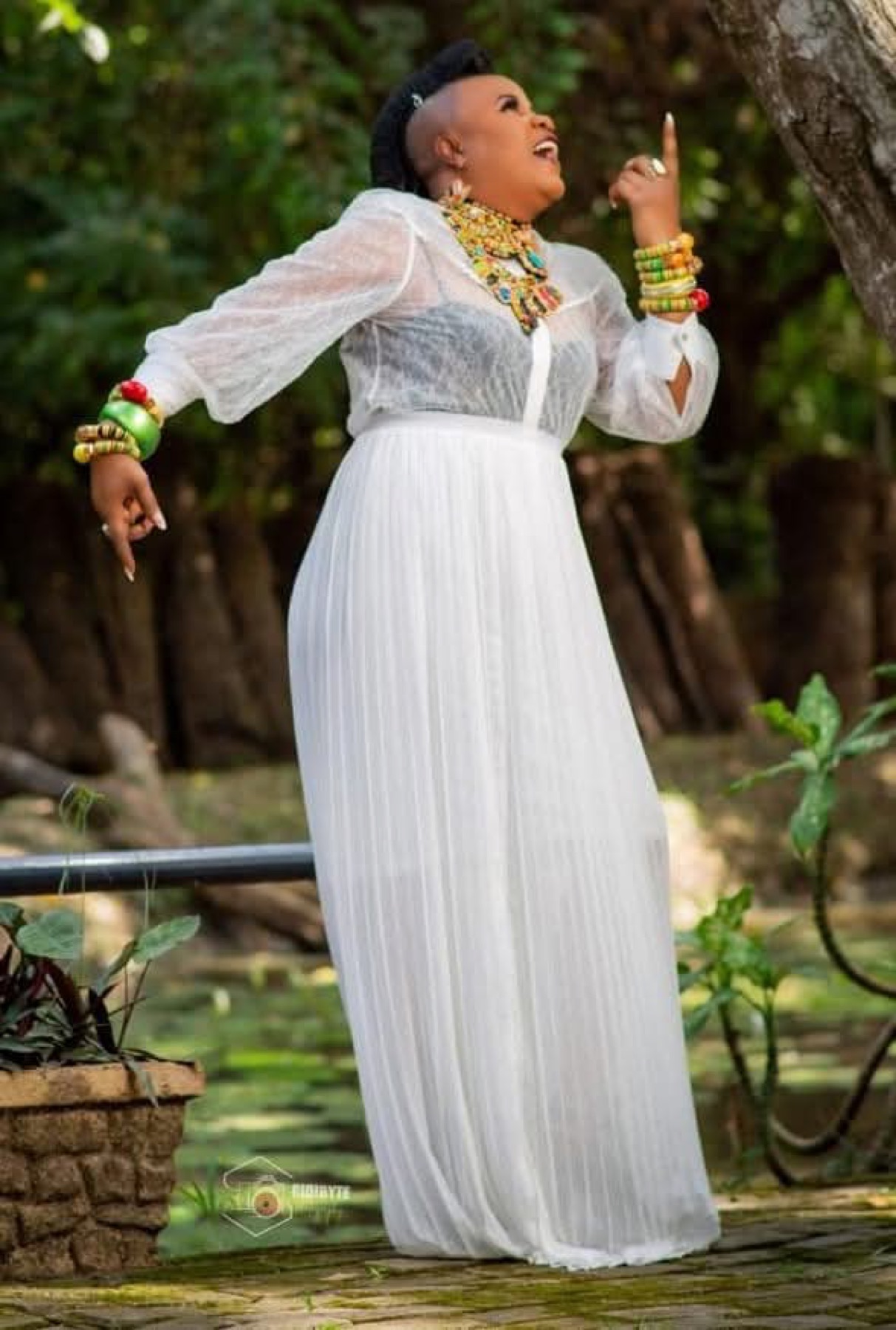 Sherifa Gunu in white, outdoors